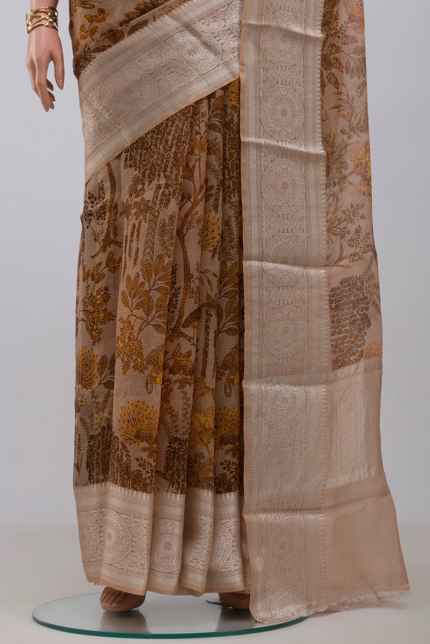 Pleats and pallu of Beige Kota Silk Saree with Printed design on the body and Zari Border. 