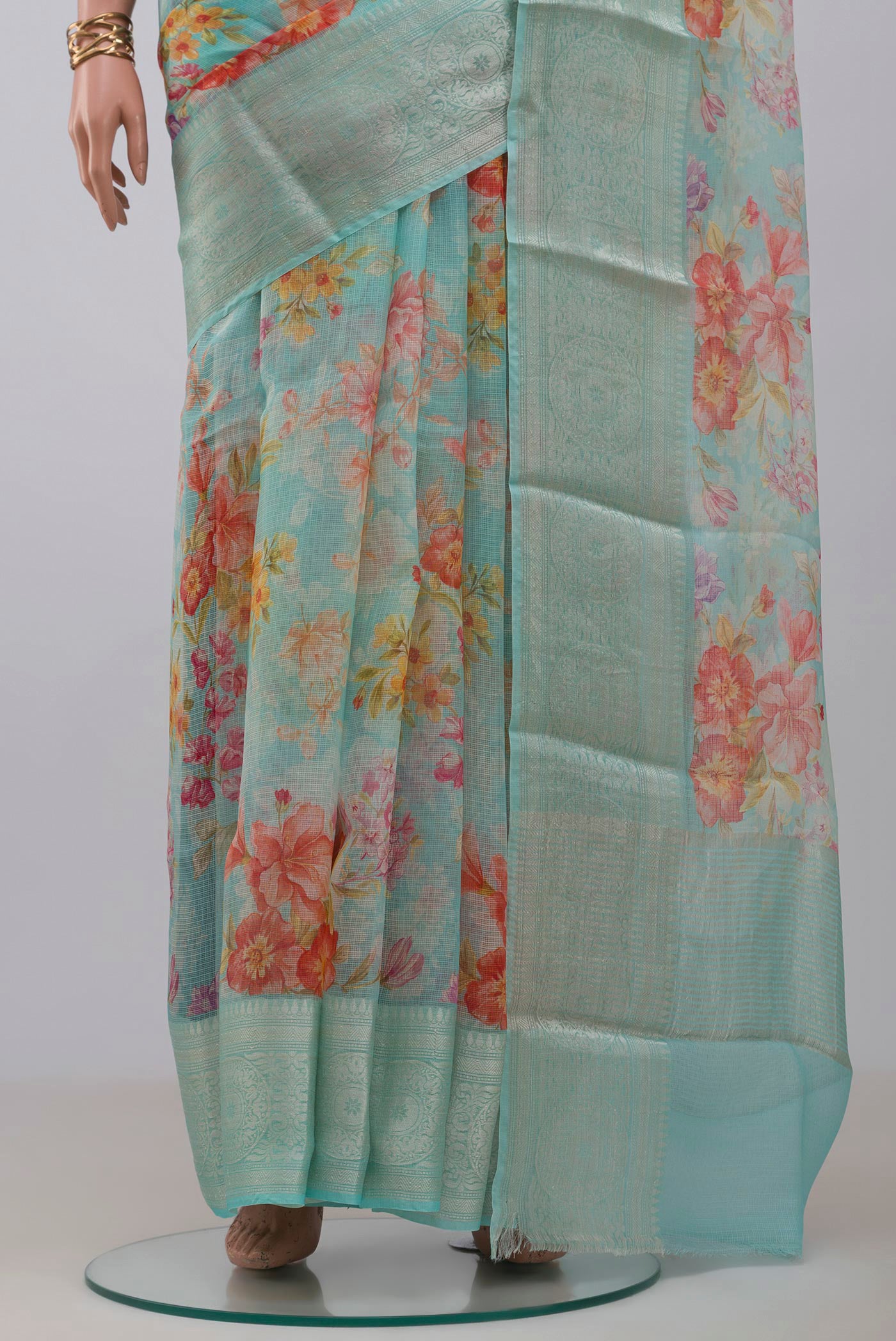 Pleats and pallu of Light Blue Kota Silk Saree with Floral Print on the body and Zari Border. 