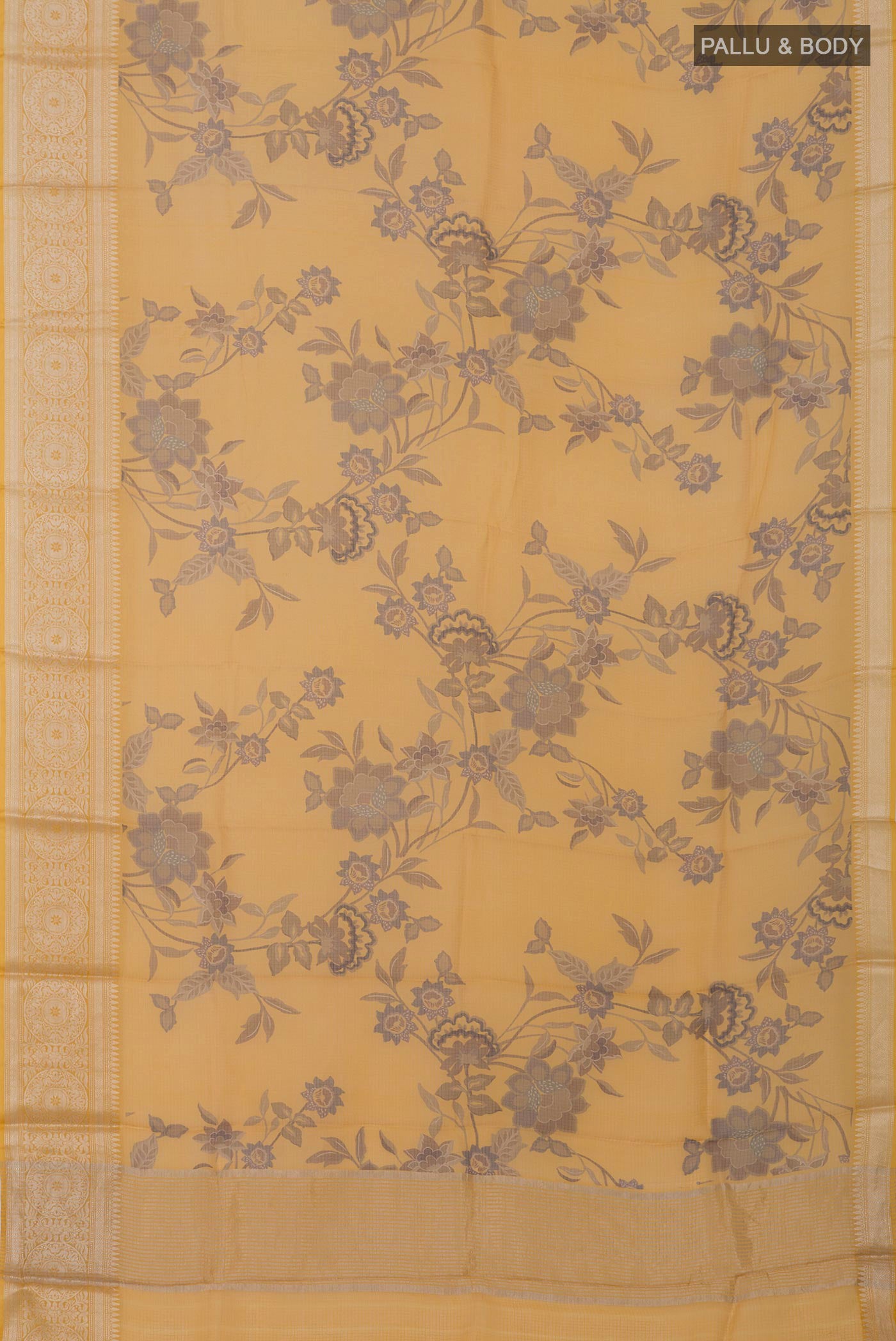 Flat view of Mustard Kota Silk Saree with Printed design on the body and Zari Border. 