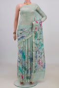 Mint Green Tussar Saree with Floral Print on the body and Thin Zari Line.  displayed on a mannequin