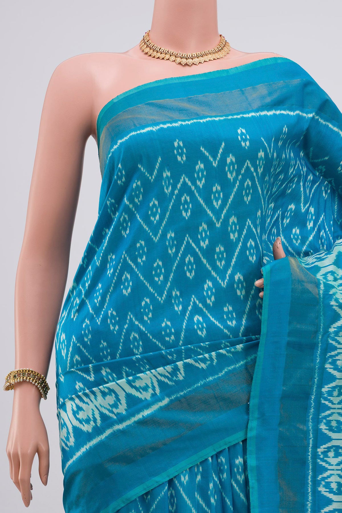 Border image of Light Blue Pochampally Silk Saree with Ikat Print on the body and Zari Border. 