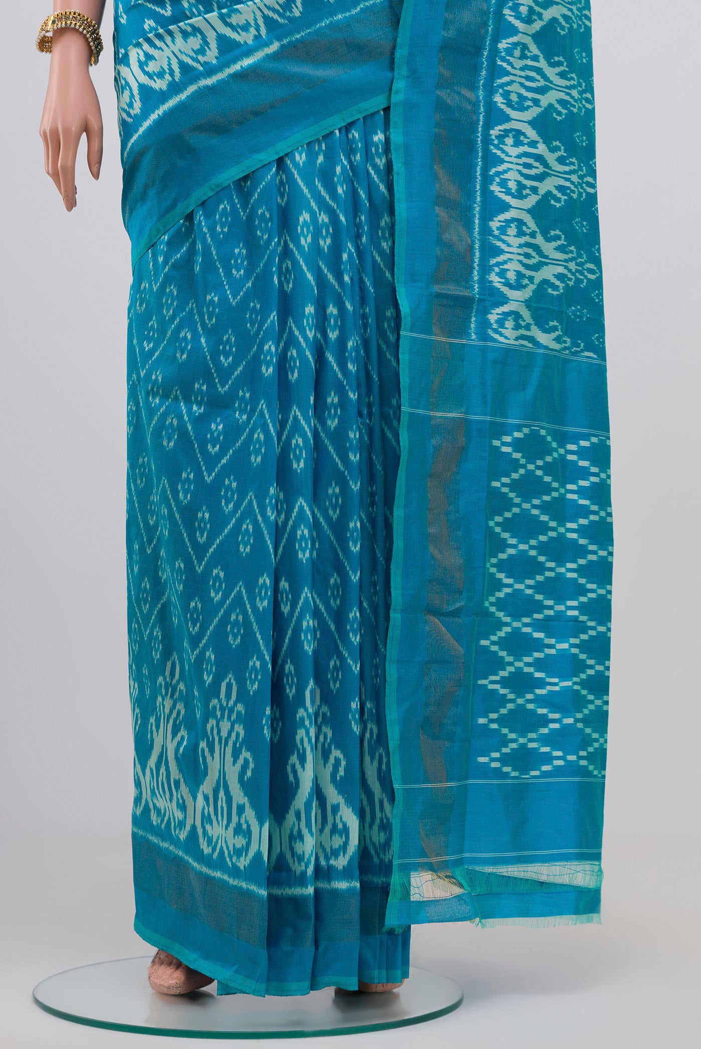 Pleats and pallu of Light Blue Pochampally Silk Saree with Ikat Print on the body and Zari Border. 