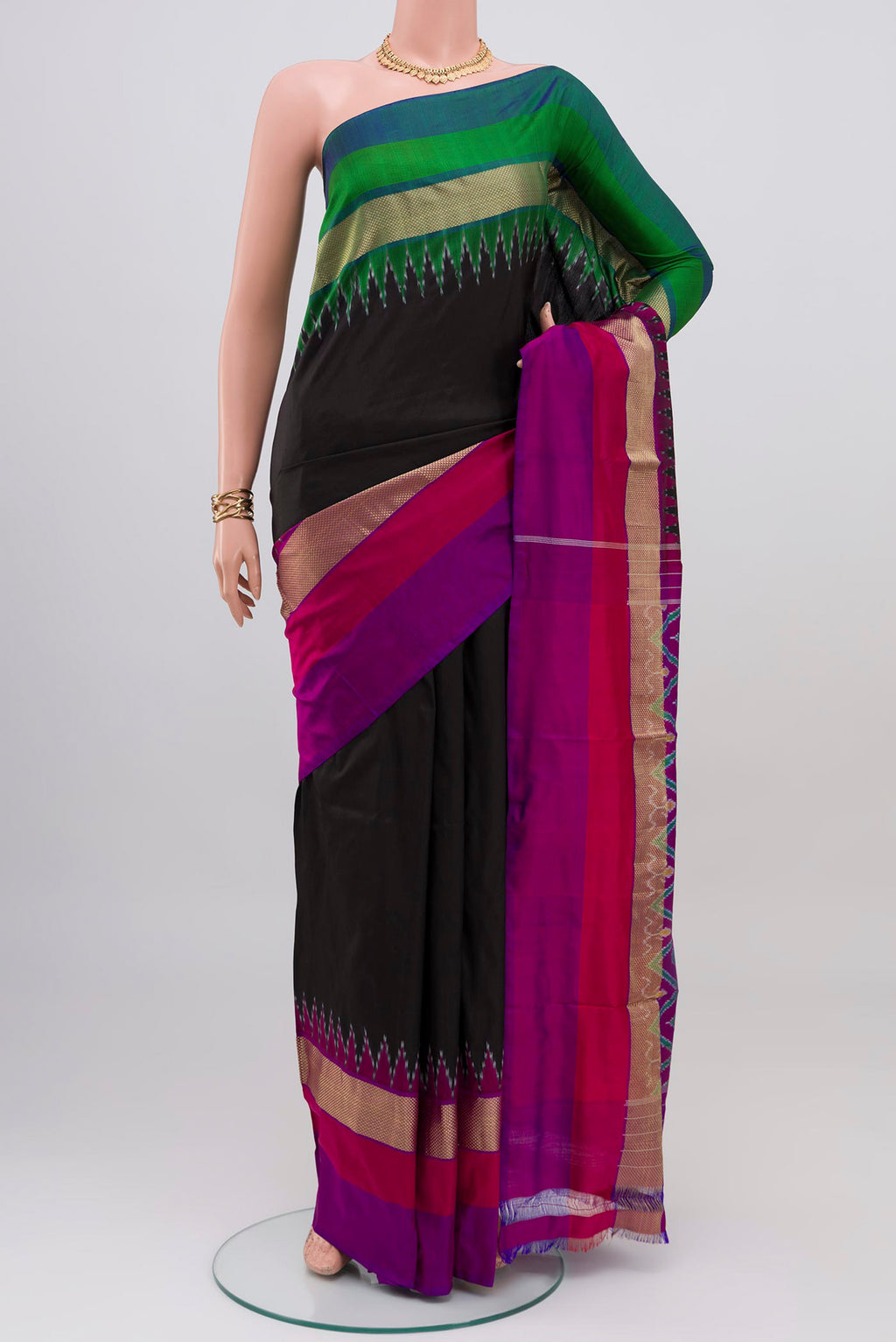 Black Pochampally Silk Saree with Plain Body and Ganga Jamuna Border.  displayed on a mannequin