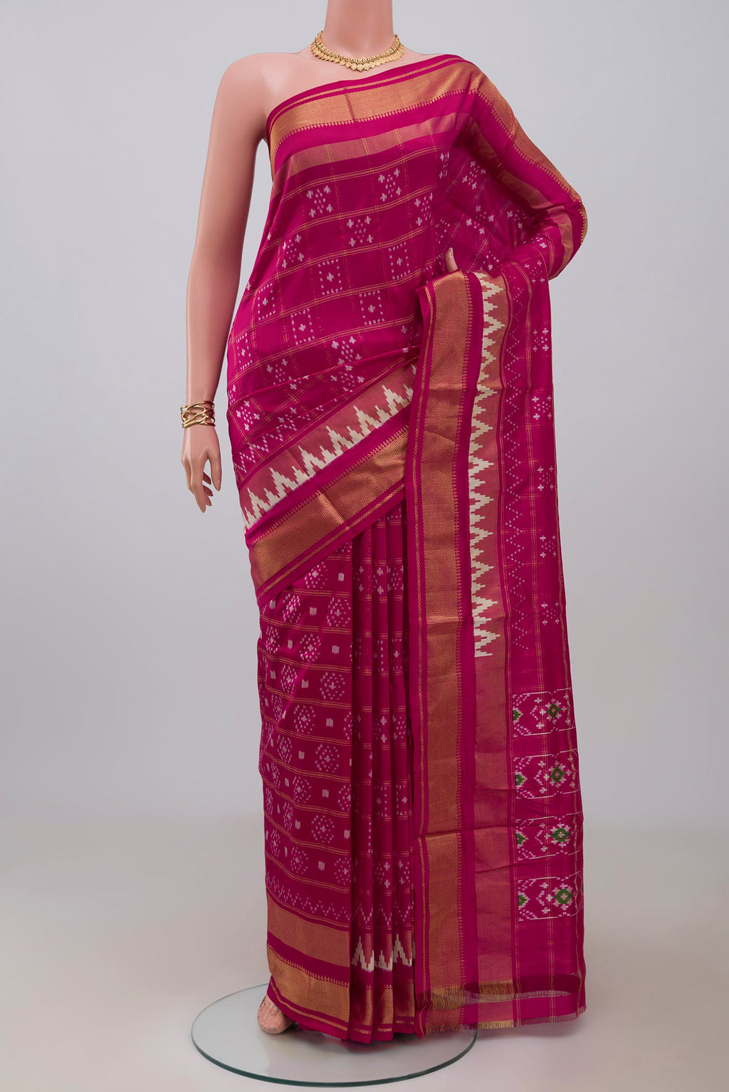 Pink Pochampally Silk Saree with Ikat design on the body and Zari Border.  displayed on a mannequin