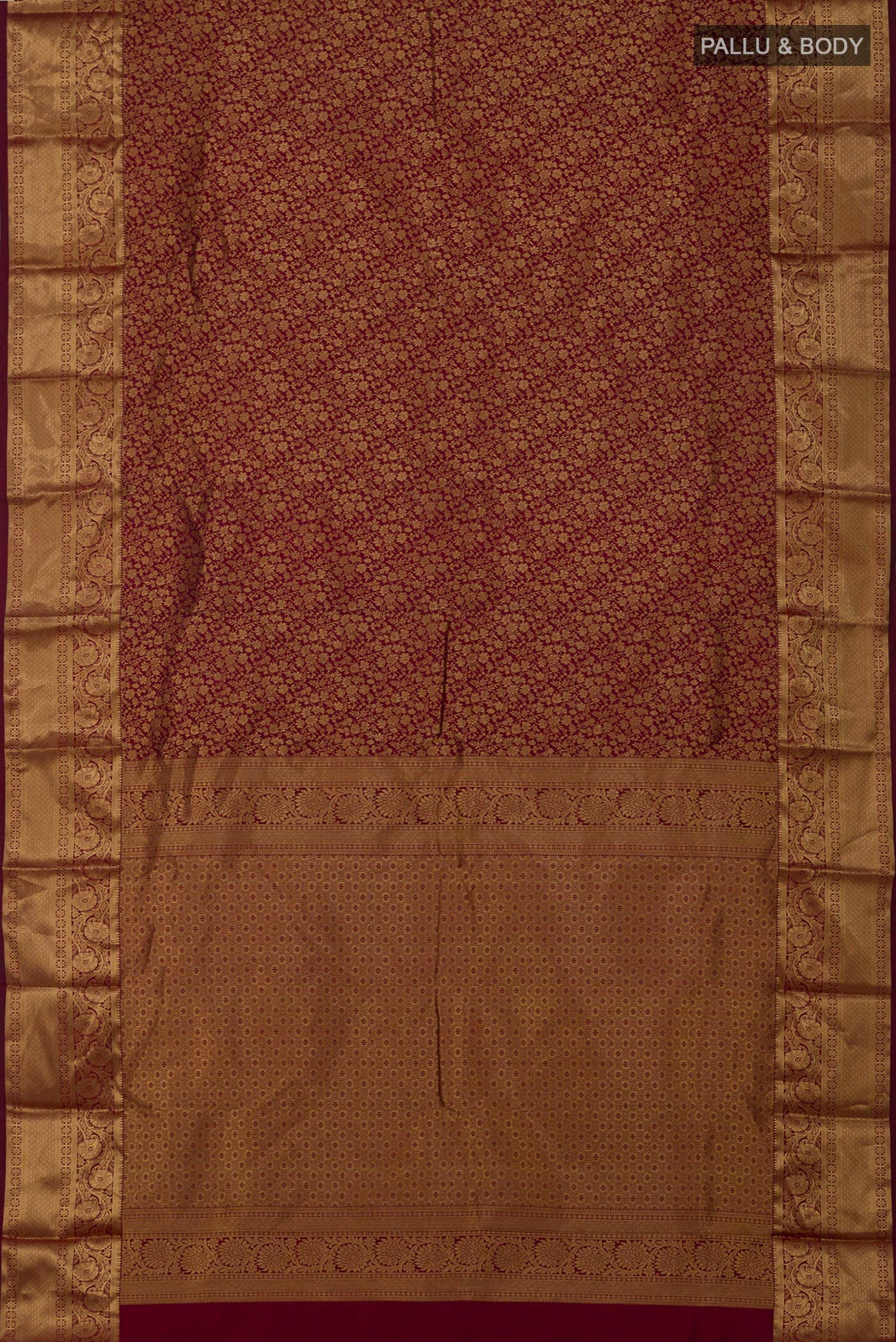 Flat view of Maroon Kanjivaram Silk Saree with Zari Brocade on the body and Zari Border. 
