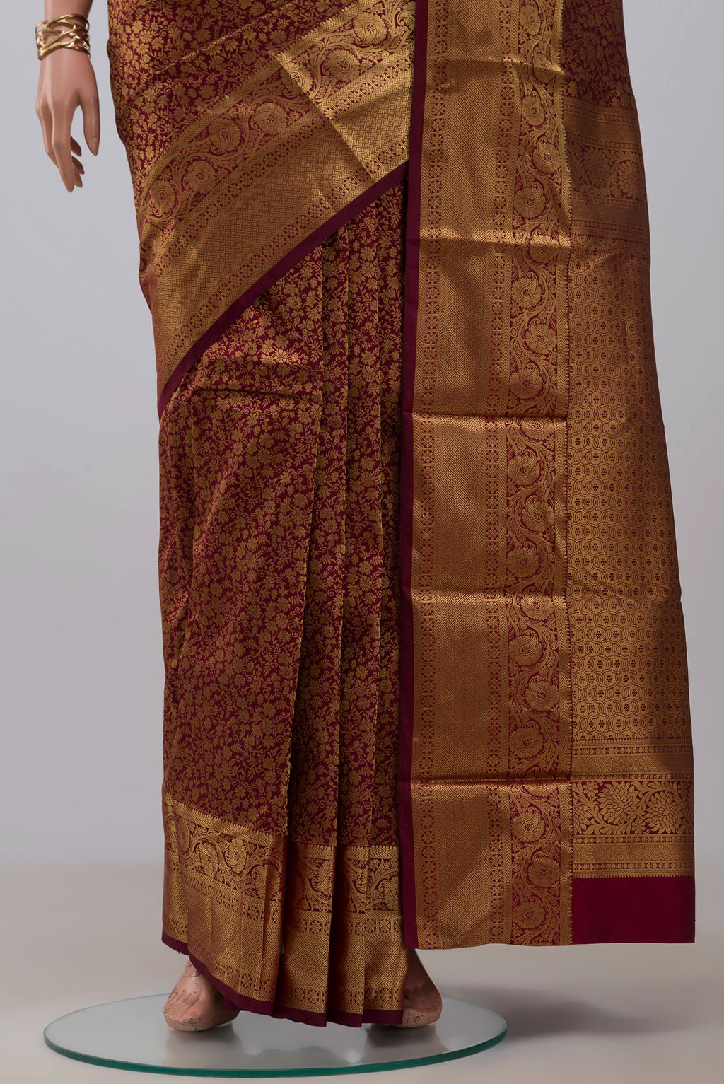 Pleats and pallu of Maroon Kanjivaram Silk Saree with Zari Brocade on the body and Zari Border. 