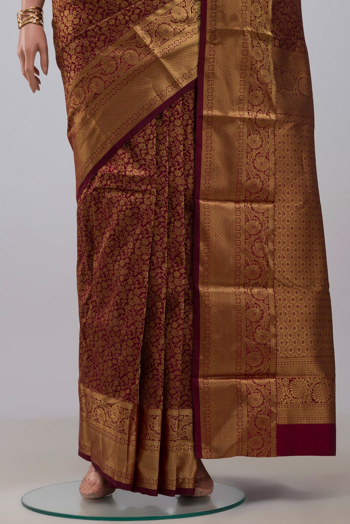 Pleats and pallu of Maroon Kanjivaram Silk Saree with Zari Brocade on the body and Zari Border. 
