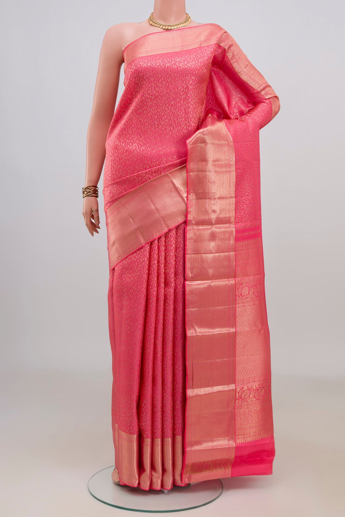Pure Silk Pink Kanchipuram Saree with Zari Brocade on the body and Zari Border.  displayed on a mannequin
