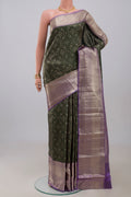 Green Kanchipuram Silk Saree with Zari Brocade on the body and Zari Border.  displayed on a mannequin