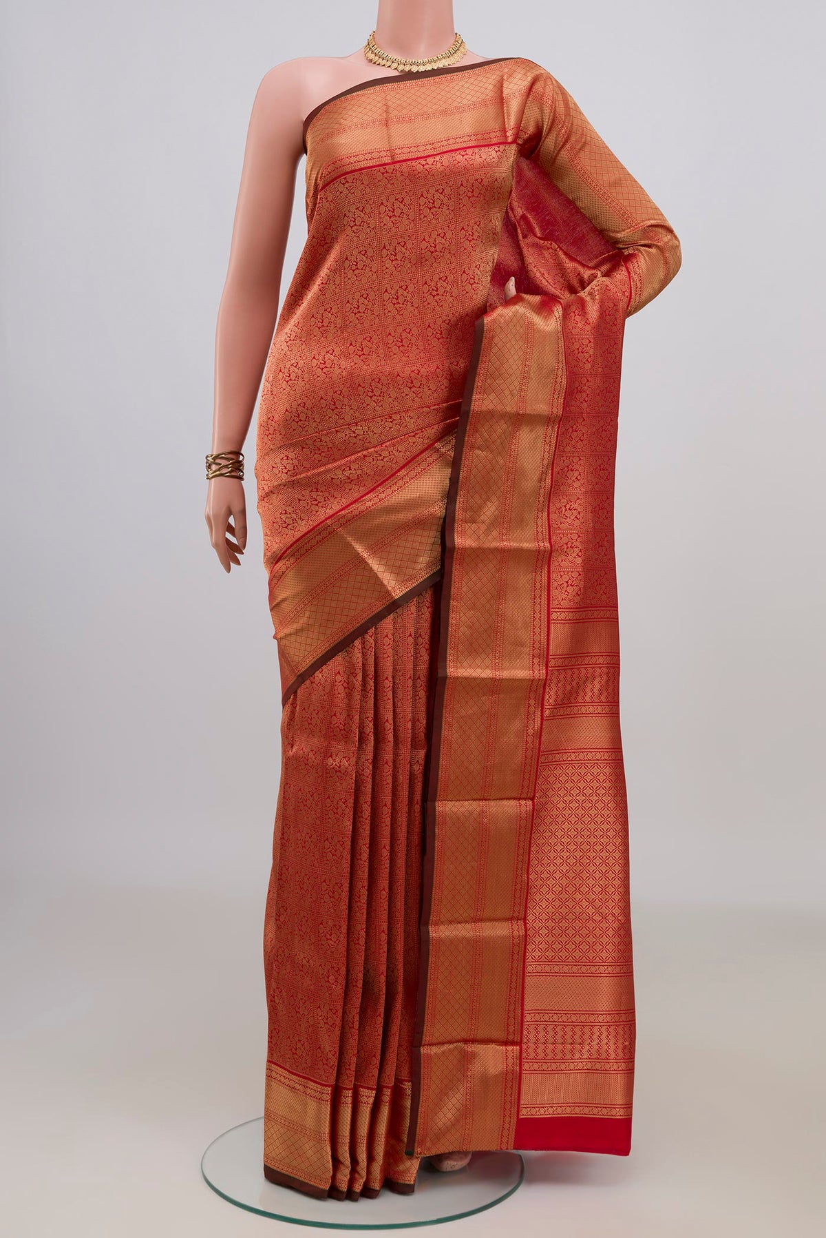 Pure Silk Red Kanchipuram Saree with Zari Brocade on the body and Zari Border.  displayed on a mannequin