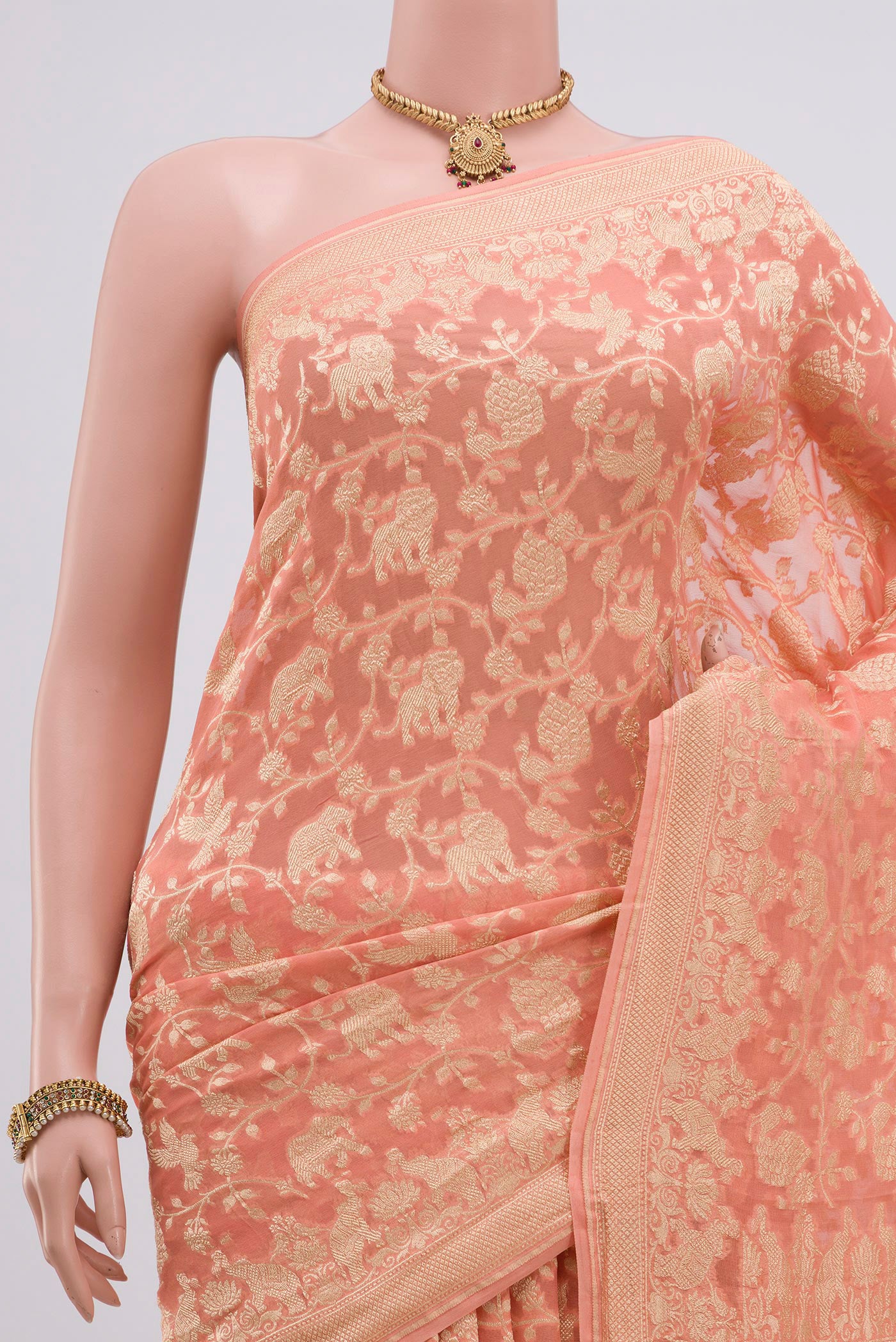Border image of Peach Georgette Saree with Fancy on the body and Zari Border. 