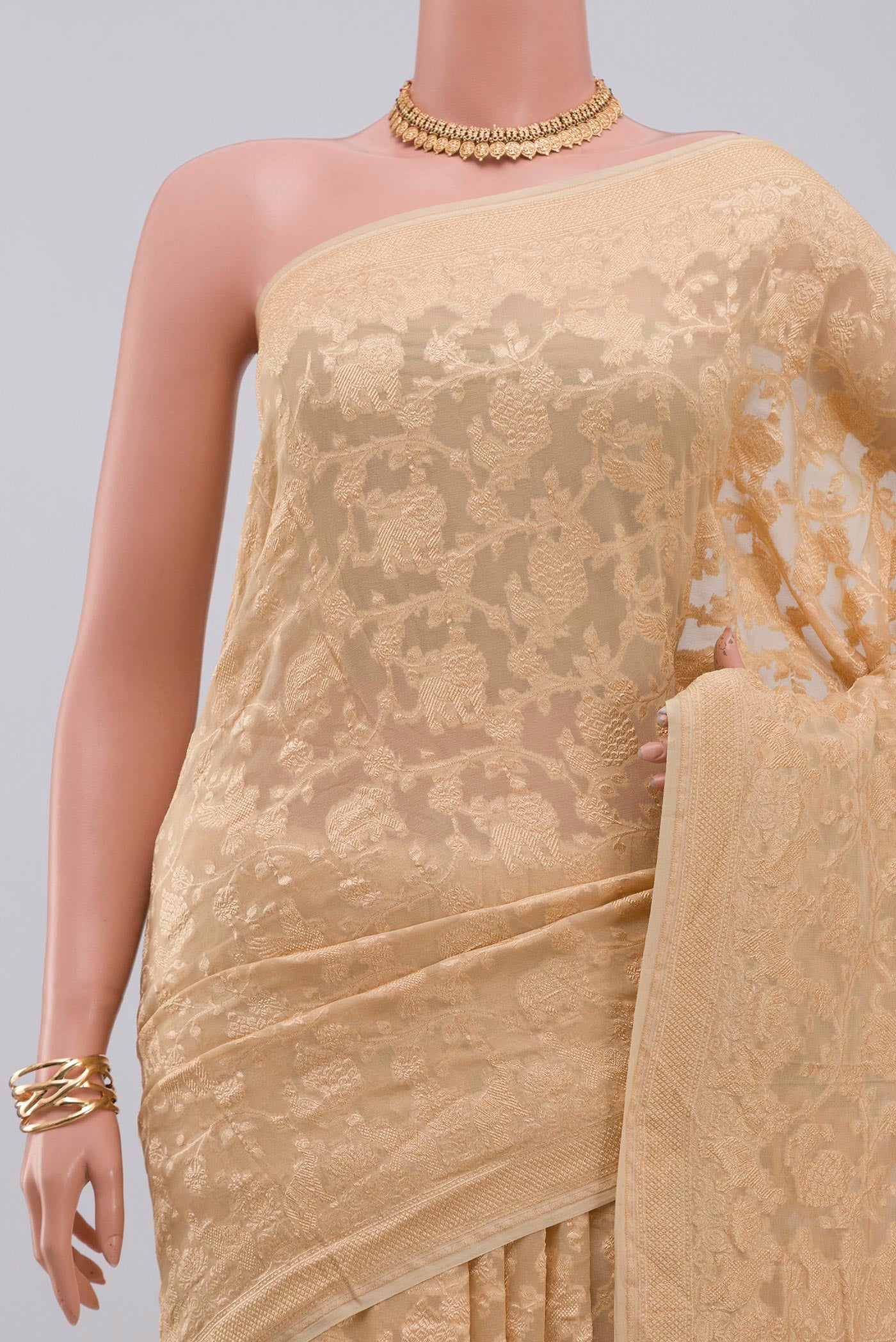 Border image of Cream Georgette Saree with Fancy on the body and Zari Border. 