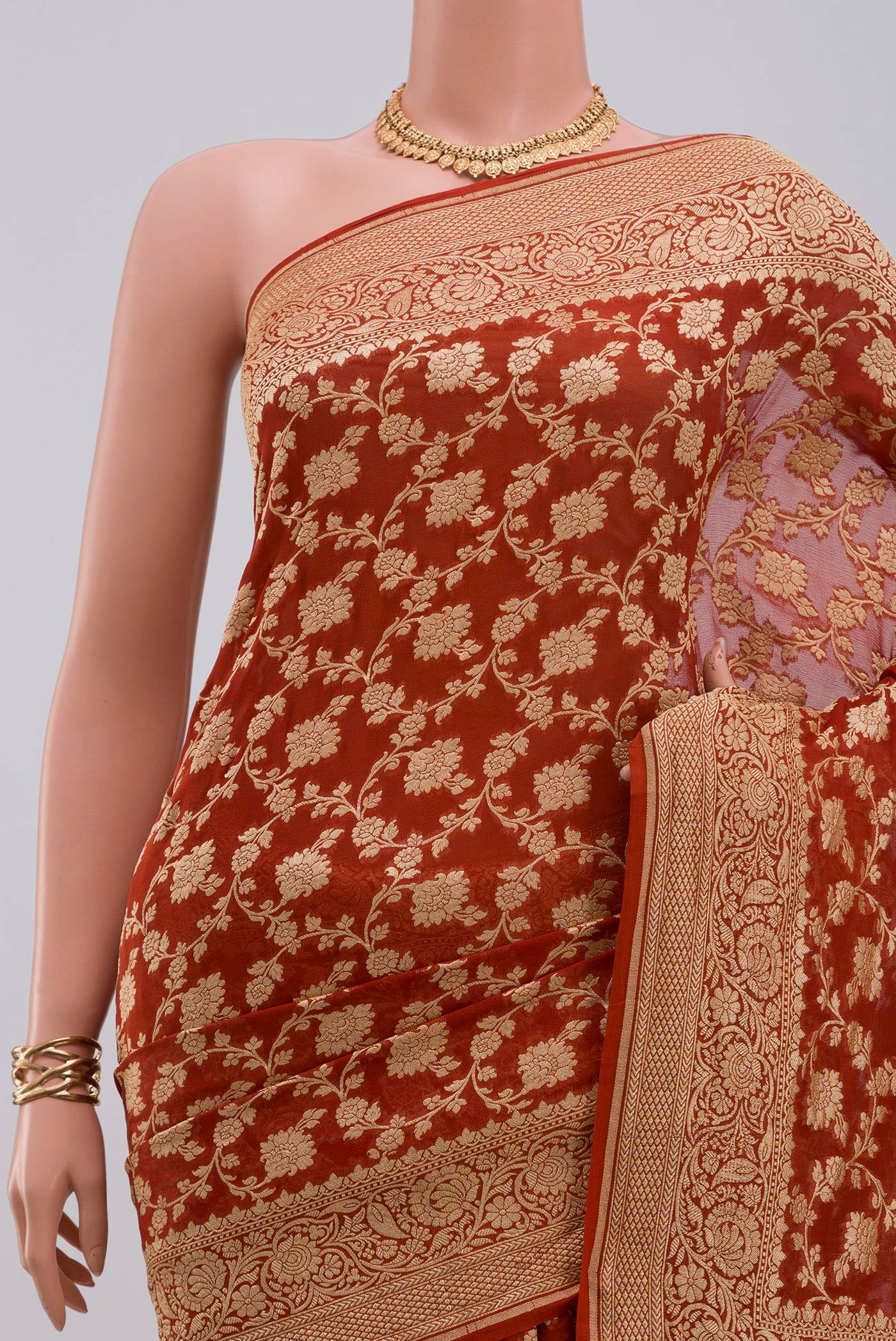 Border image of Rust Georgette Saree with Fancy on the body and Fancy Border. 