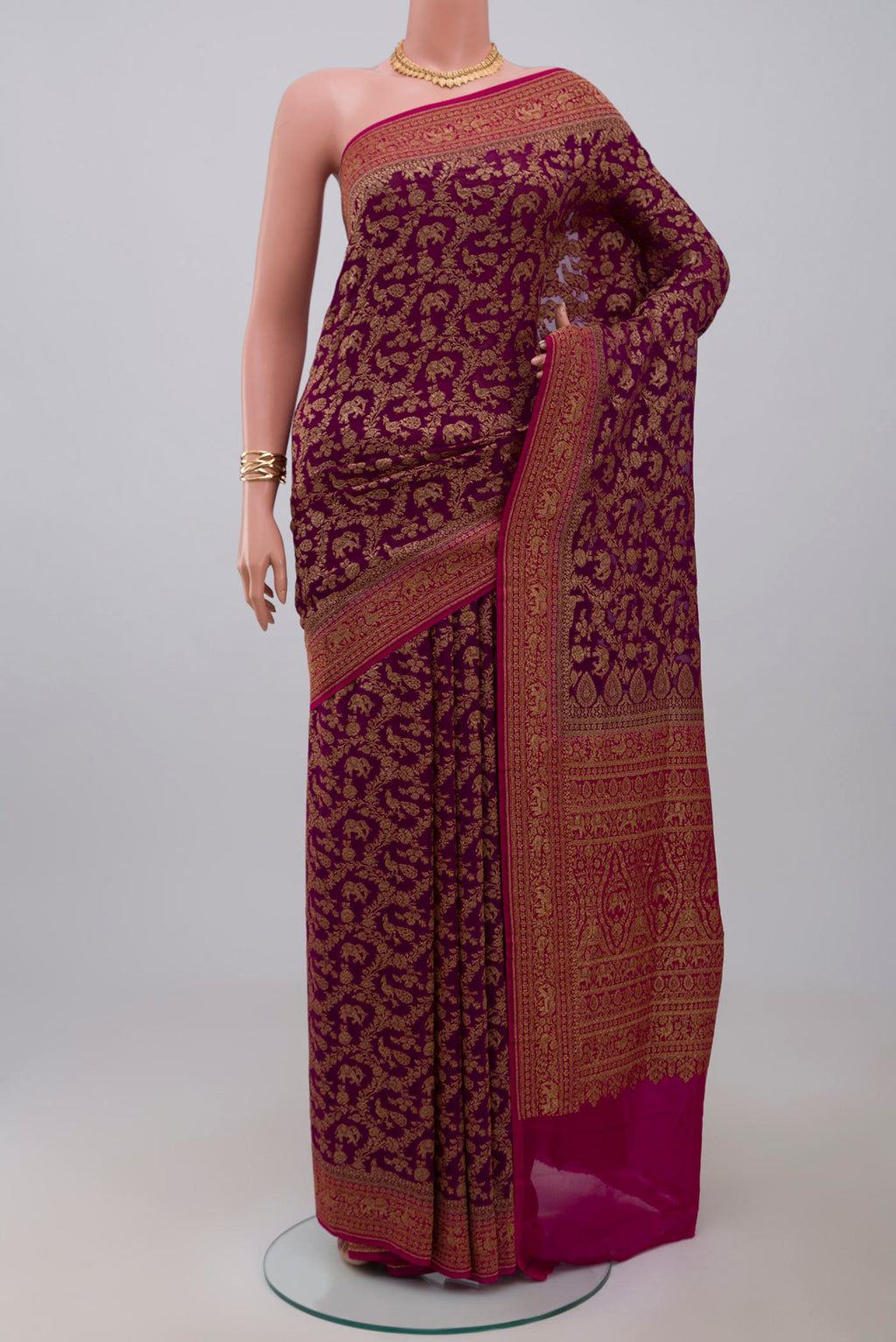 Purple Banarasi Georgette Saree with Fancy on the body and Fancy Border.  displayed on a mannequin