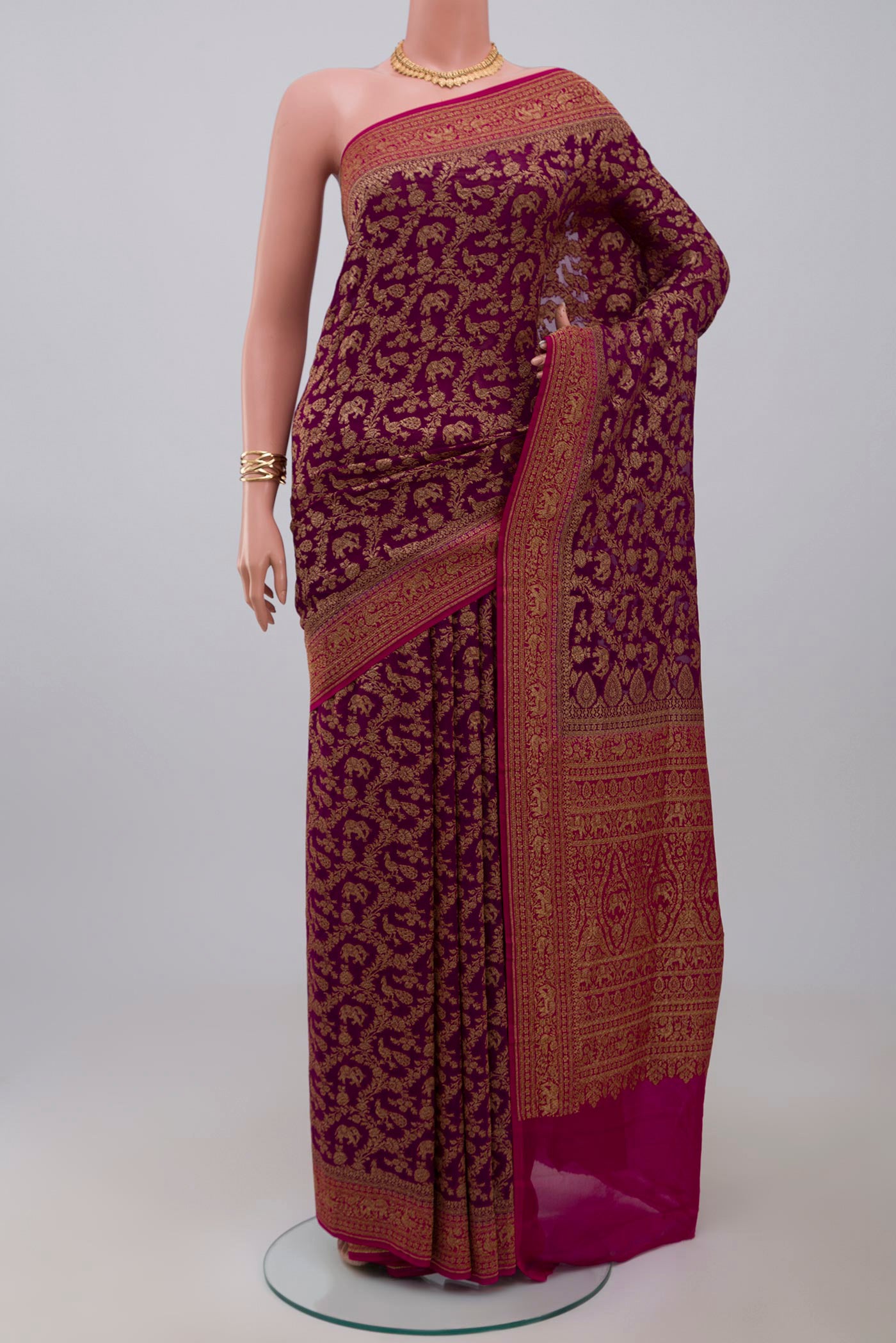 Purple Banarasi Georgette Saree with Fancy on the body and Fancy Border.  displayed on a mannequin