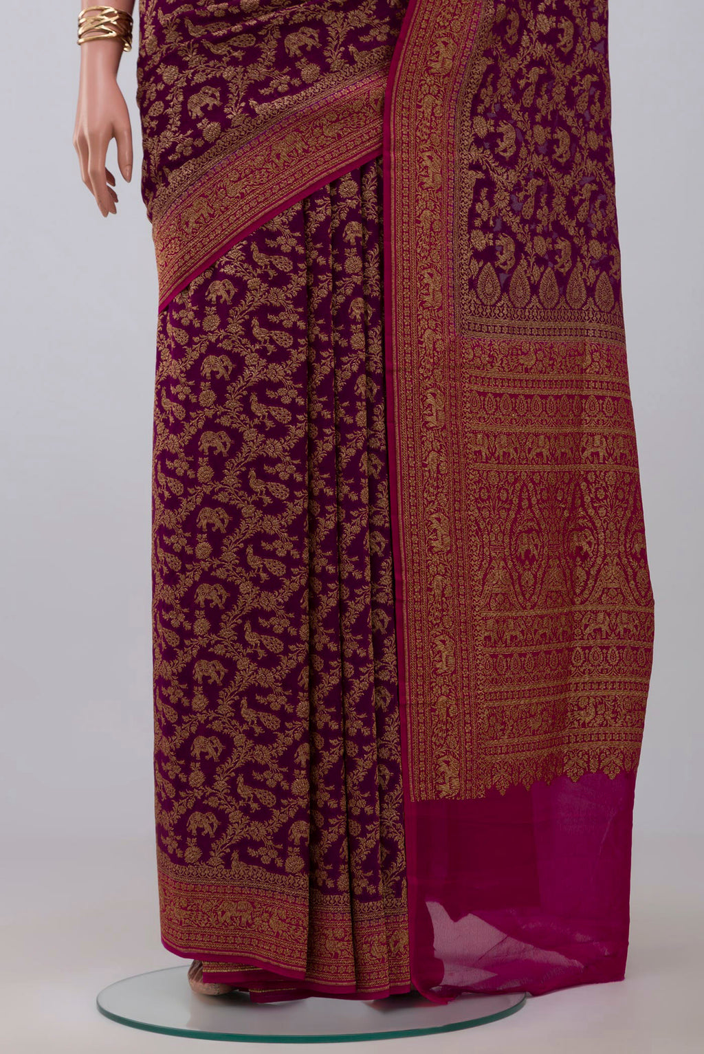 Pleats and pallu of Purple Banarasi Georgette Saree with Fancy on the body and Fancy Border. 