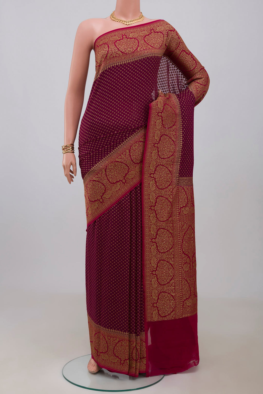 Purple Georgette Saree with Fancy on the body and Fancy Border.  displayed on a mannequin