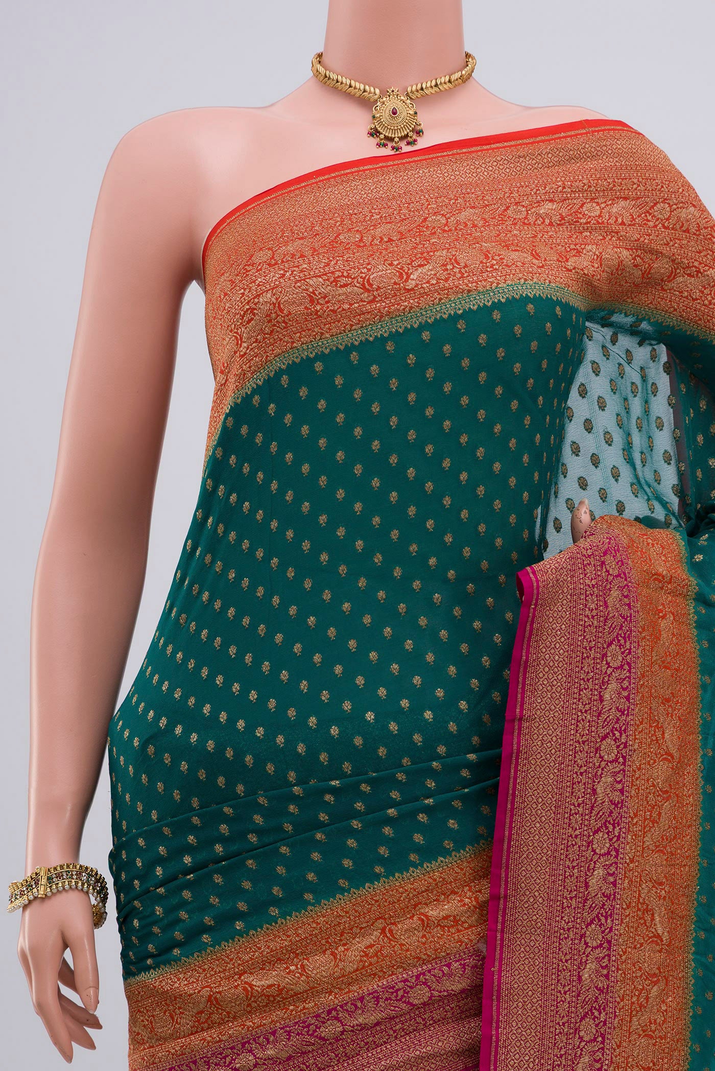 Border image of Green Georgette Saree with Zari Butta on the body and Zari Border. 