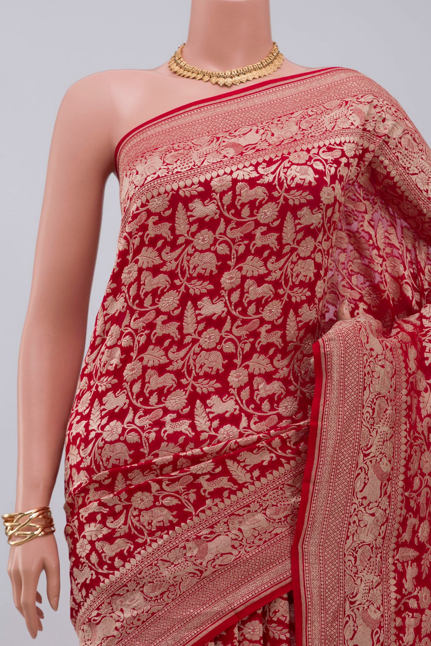 Border image of Red Banarasi Georgette Saree with Fancy on the body and Zari Border. 