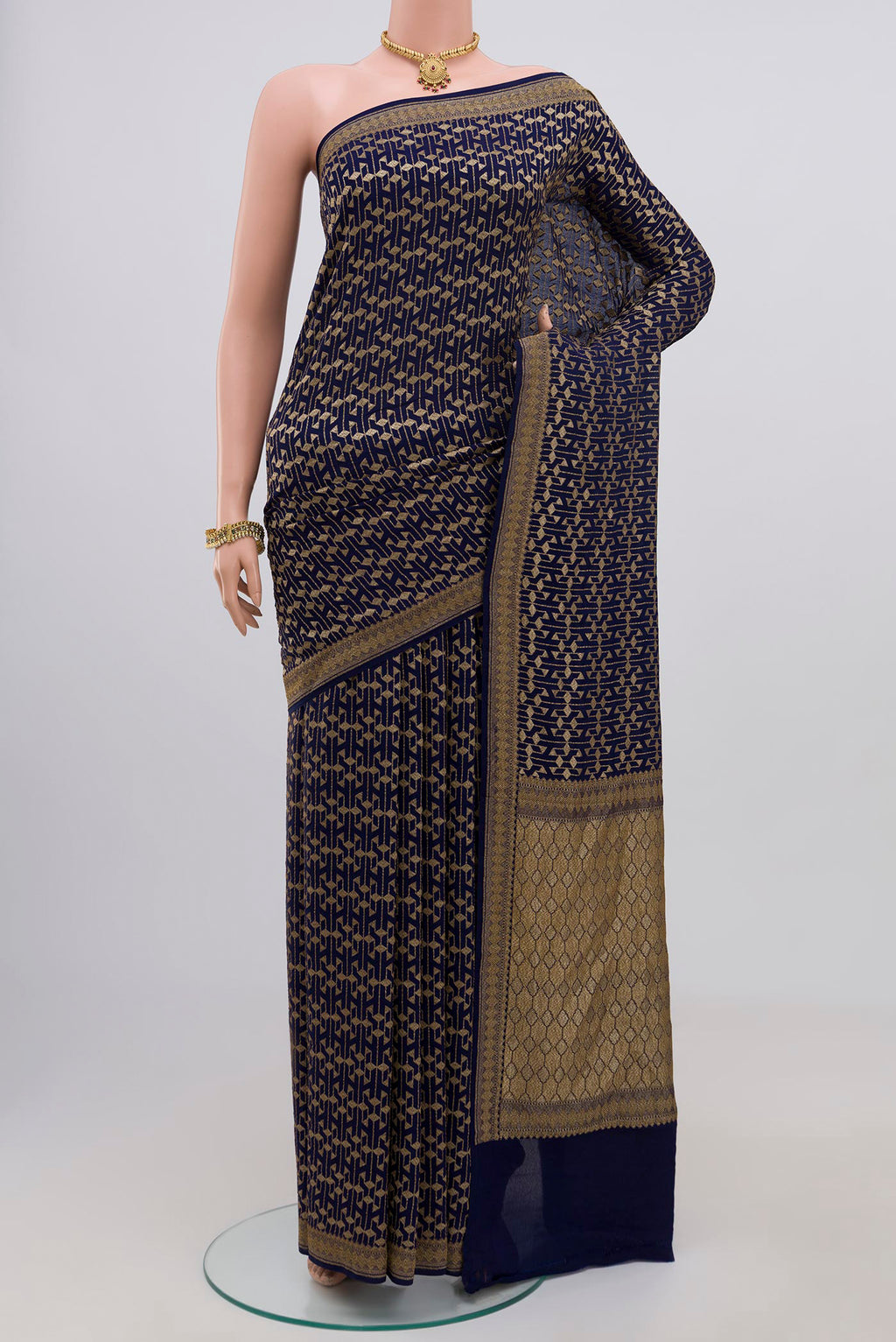 Blue Georgette Saree with Fancy on the body and Zari Border.  displayed on a mannequin