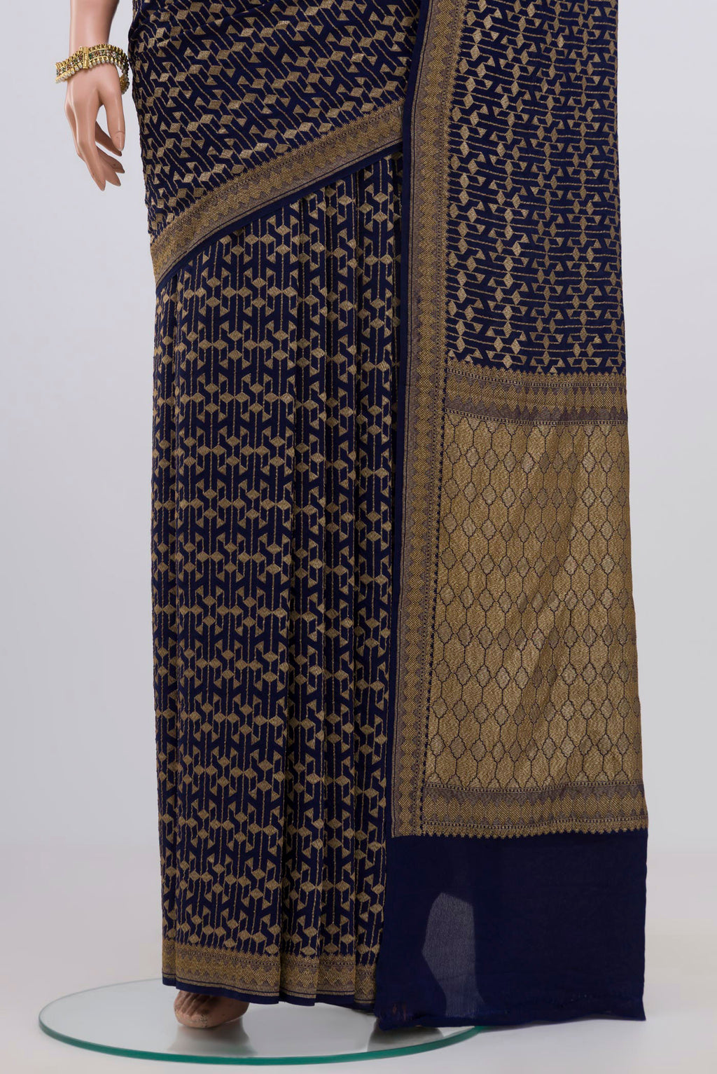Pleats and pallu of Blue Georgette Saree with Fancy on the body and Zari Border. 
