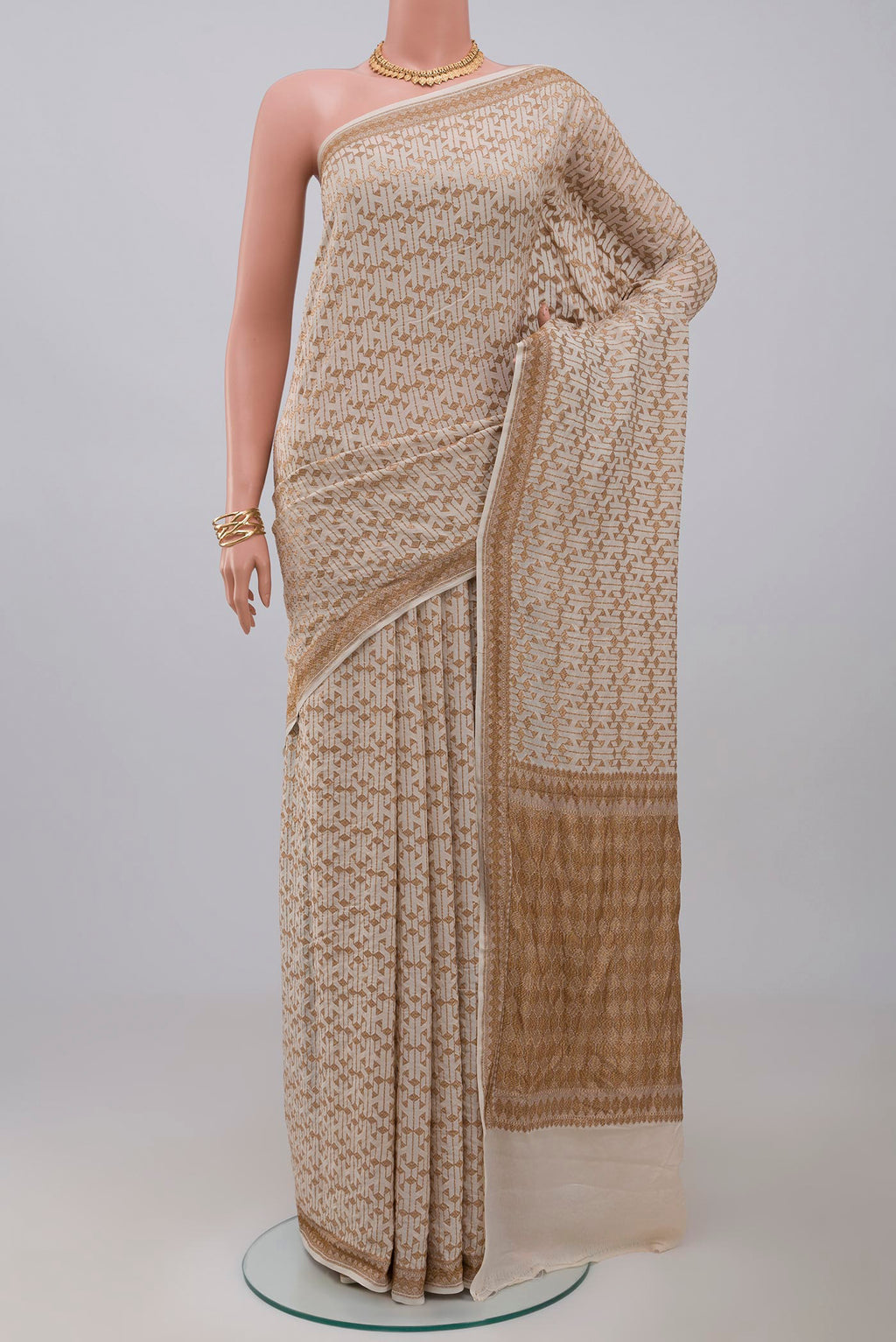 Cream Banarasi Georgette Saree with Fancy on the body and Zari Border.  displayed on a mannequin