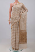 Cream Banarasi Georgette Saree with Fancy on the body and Zari Border.  displayed on a mannequin
