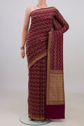 Maroon Banarasi Georgette Saree with Zari Brocade on the body and Zari Border.  displayed on a mannequin