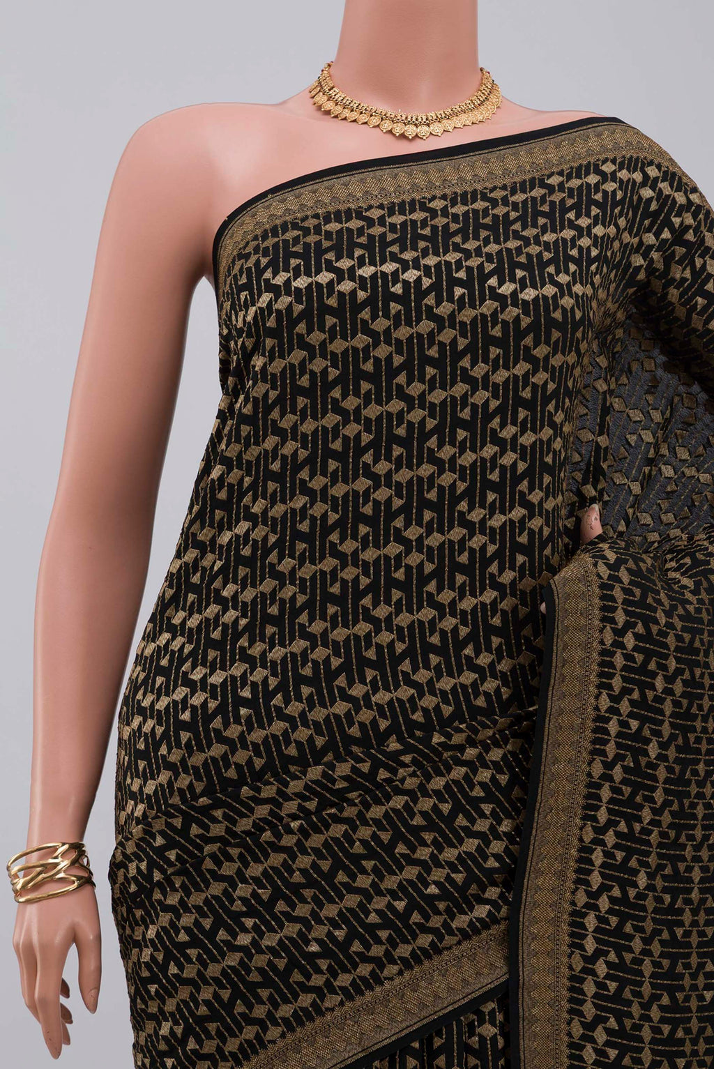 Border image of Black Georgette Saree with Fancy on the body and Zari Border. 