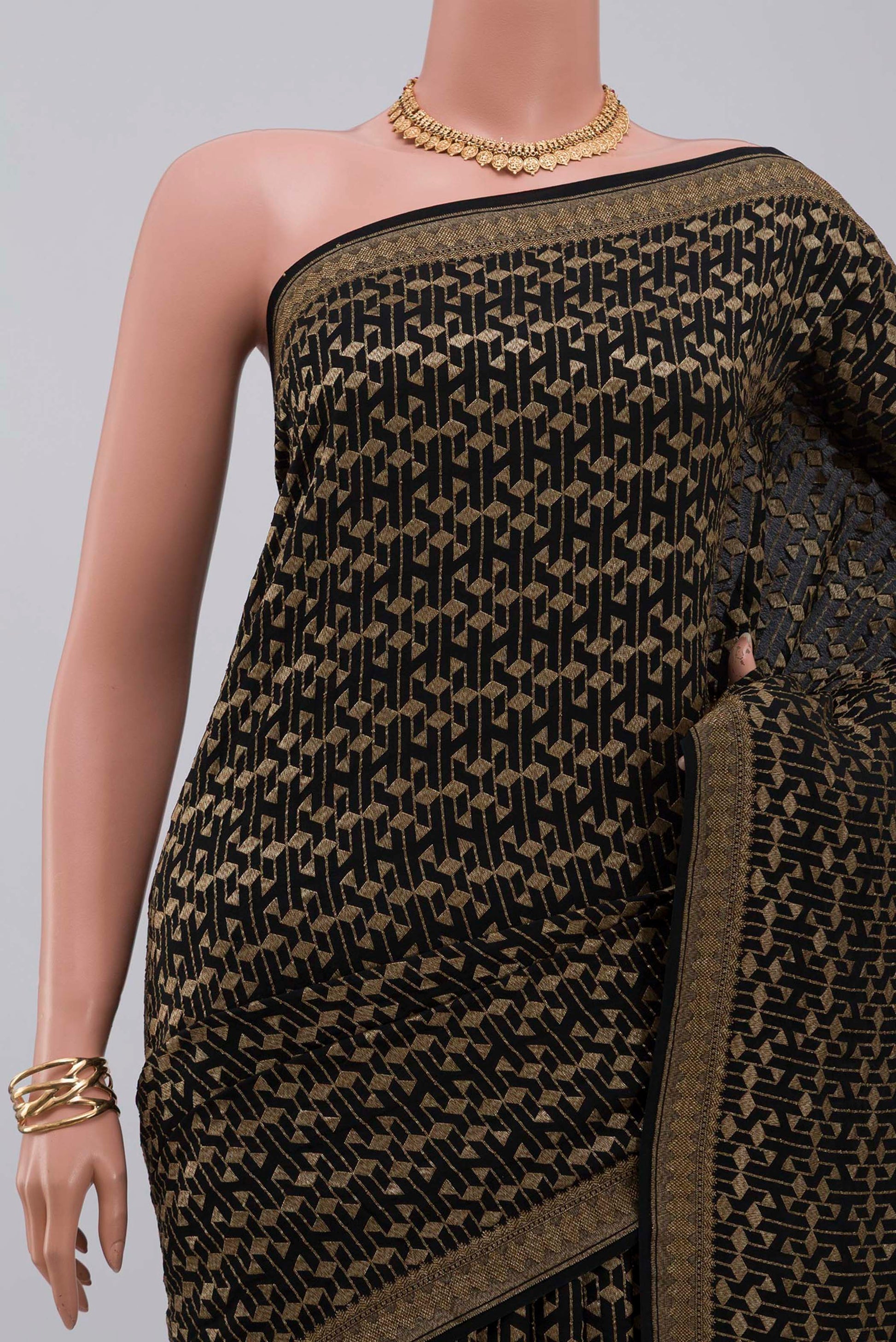 Border image of Black Georgette Saree with Fancy on the body and Zari Border. 