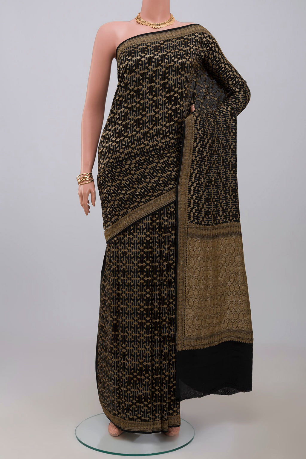 Black Georgette Saree with Fancy on the body and Zari Border.  displayed on a mannequin