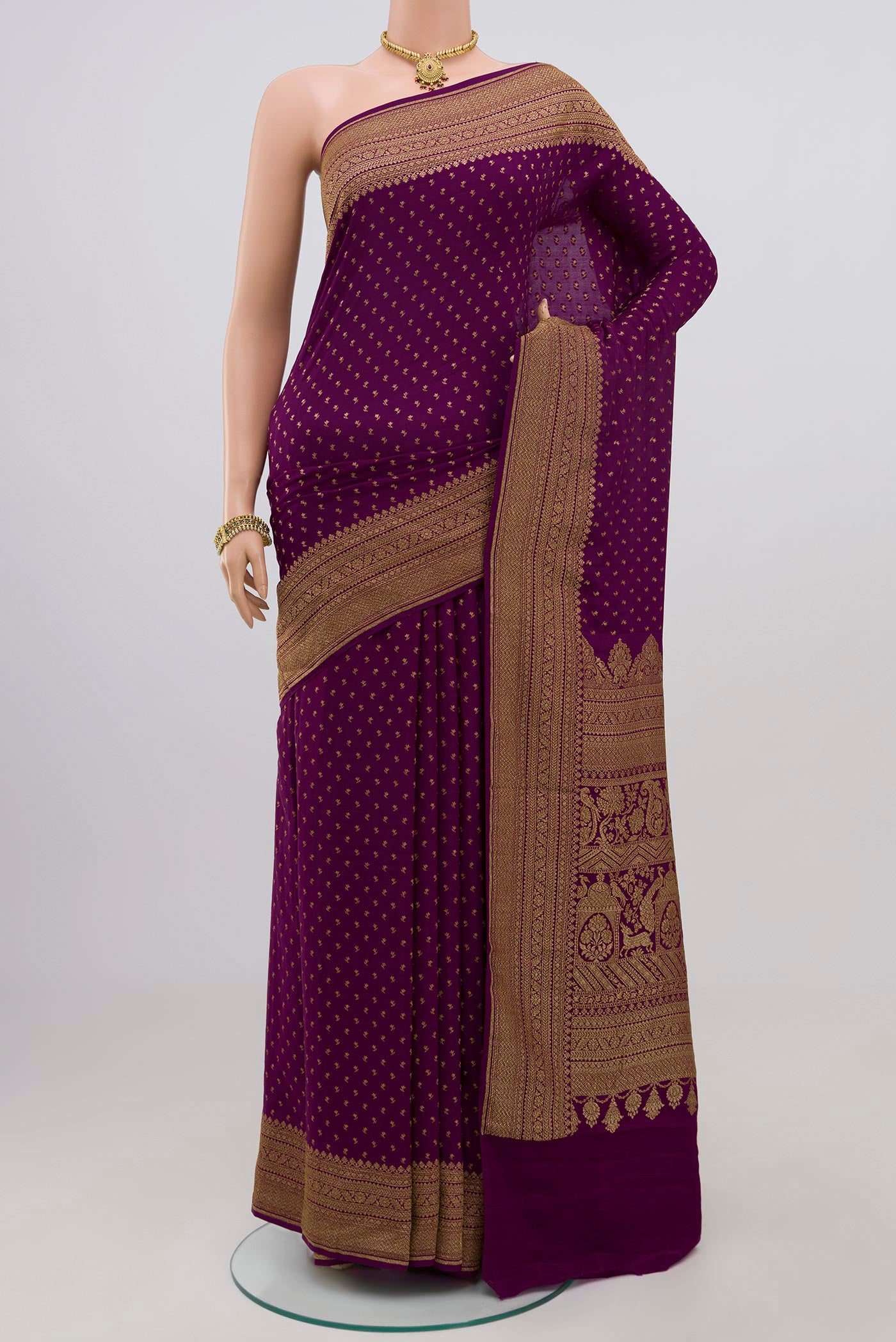 Purple Georgette Saree with Fancy on the body and Zari Border.  displayed on a mannequin