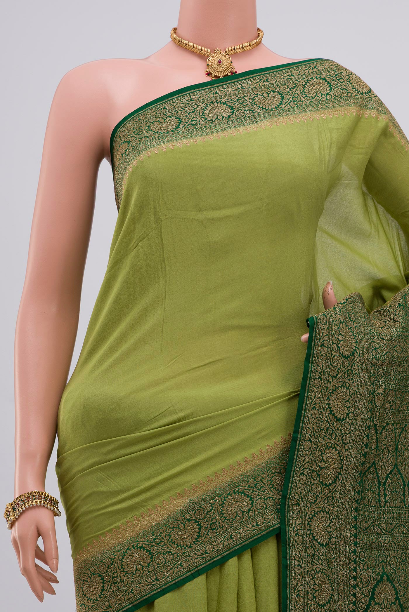 Border image of Light Green Georgette Saree with Fancy on the body and Zari Border. 