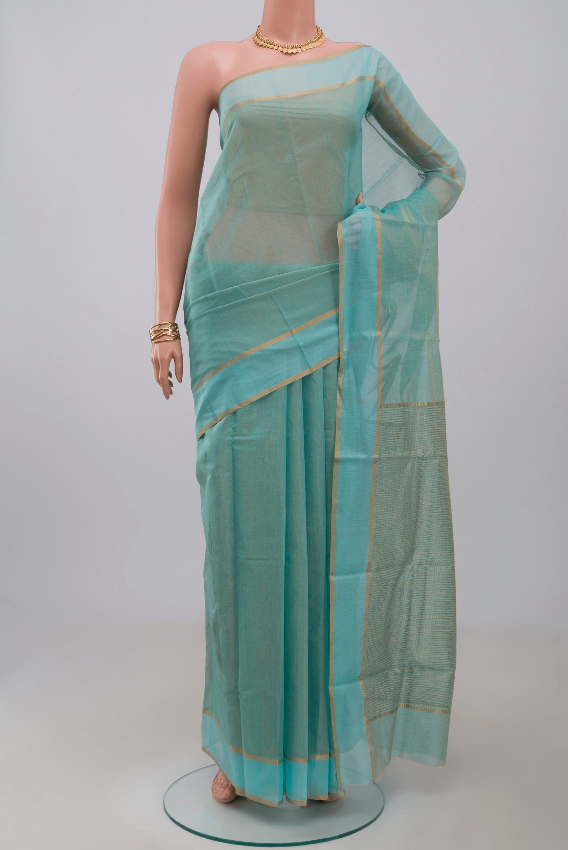 Blue Chanderi Silk Cotton Saree with Plain Body and Zari Border.  displayed on a mannequin