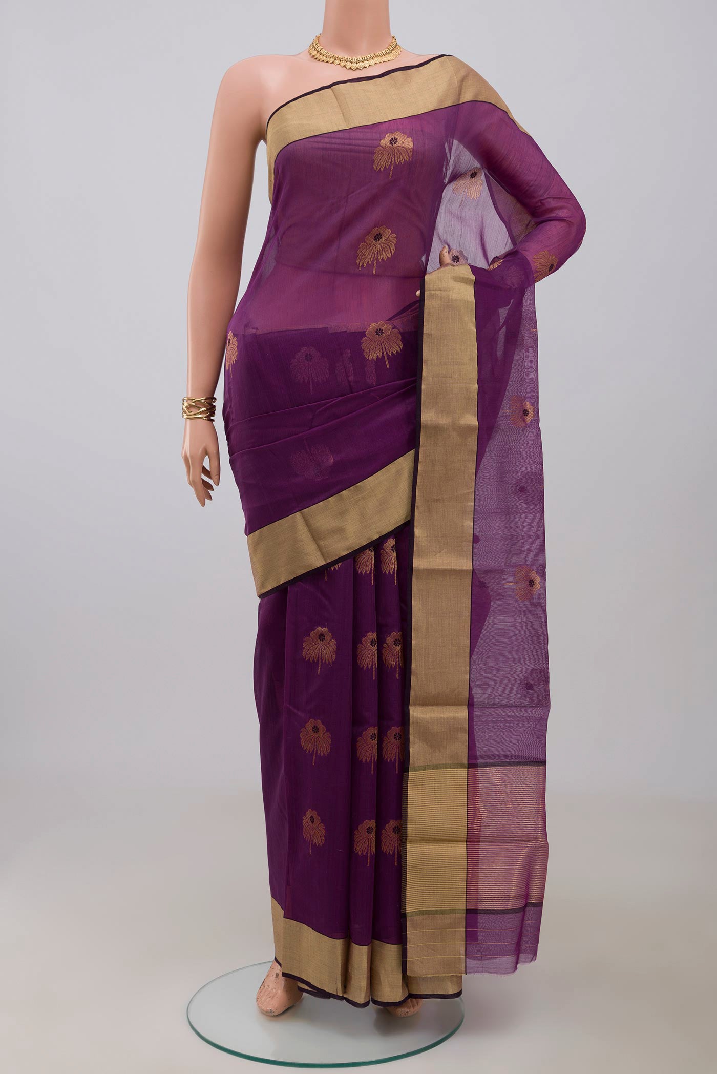 Purple Chanderi Silk Cotton Saree with Zari Butta on the body and Zari Border.  displayed on a mannequin