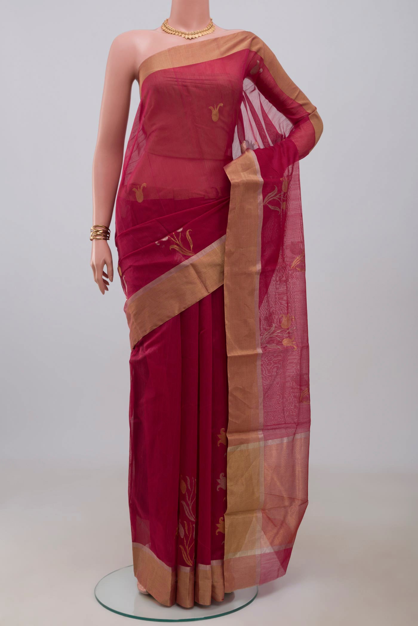 Dark Pink Chanderi Silk Cotton Saree with Zari Butta on the body and Zari Border.  displayed on a mannequin
