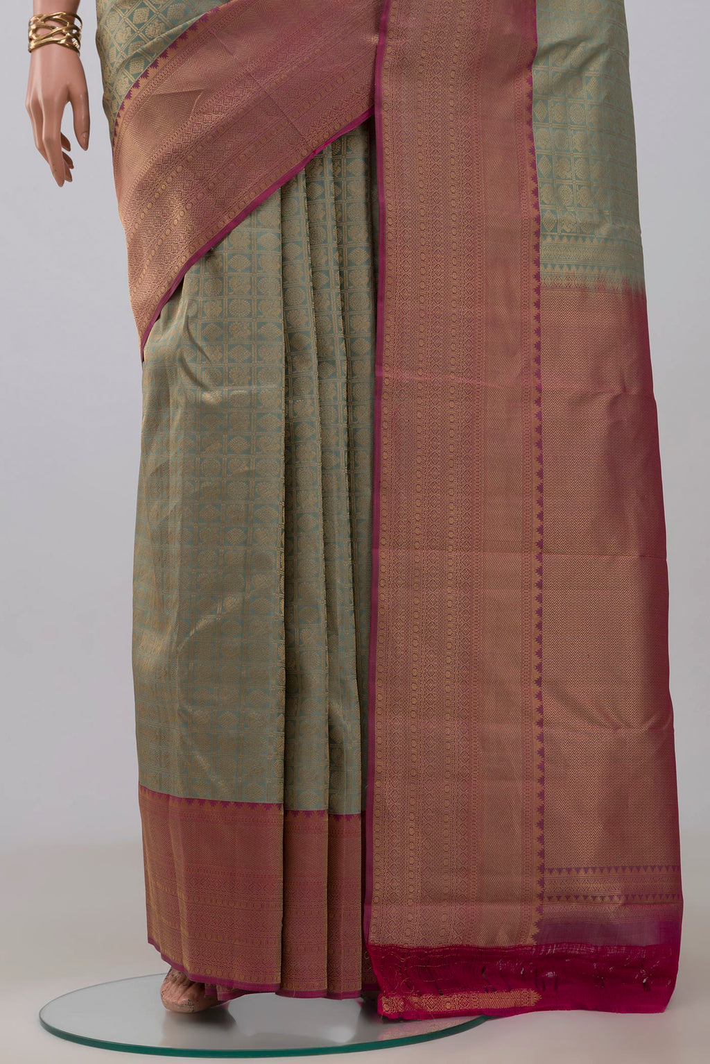 Pleats and pallu of Sage Green Kanchipuram Silk Saree with Zari Brocade on the body and Zari Border. 