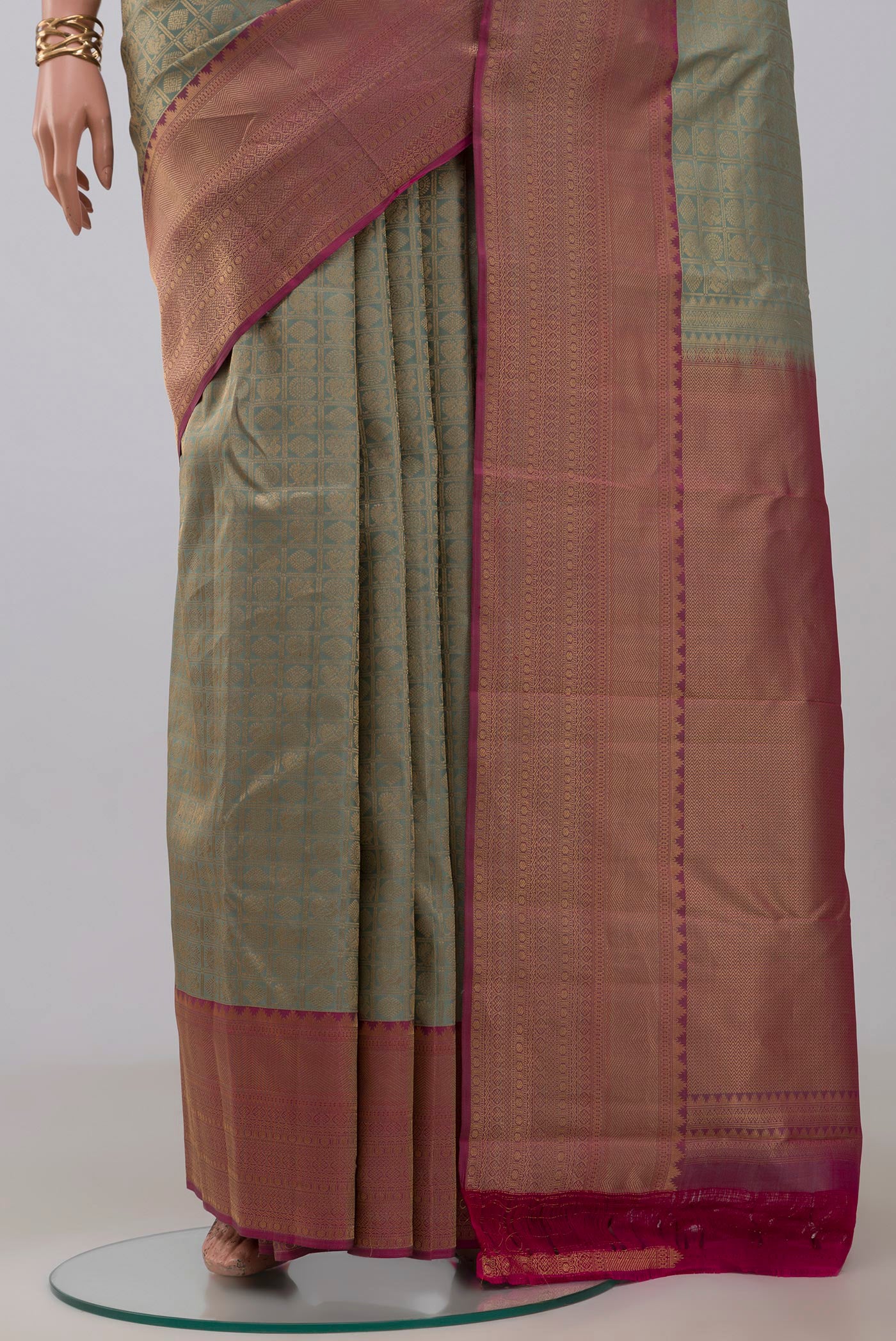 Pleats and pallu of Sage Green Kanchipuram Silk Saree with Zari Brocade on the body and Zari Border. 