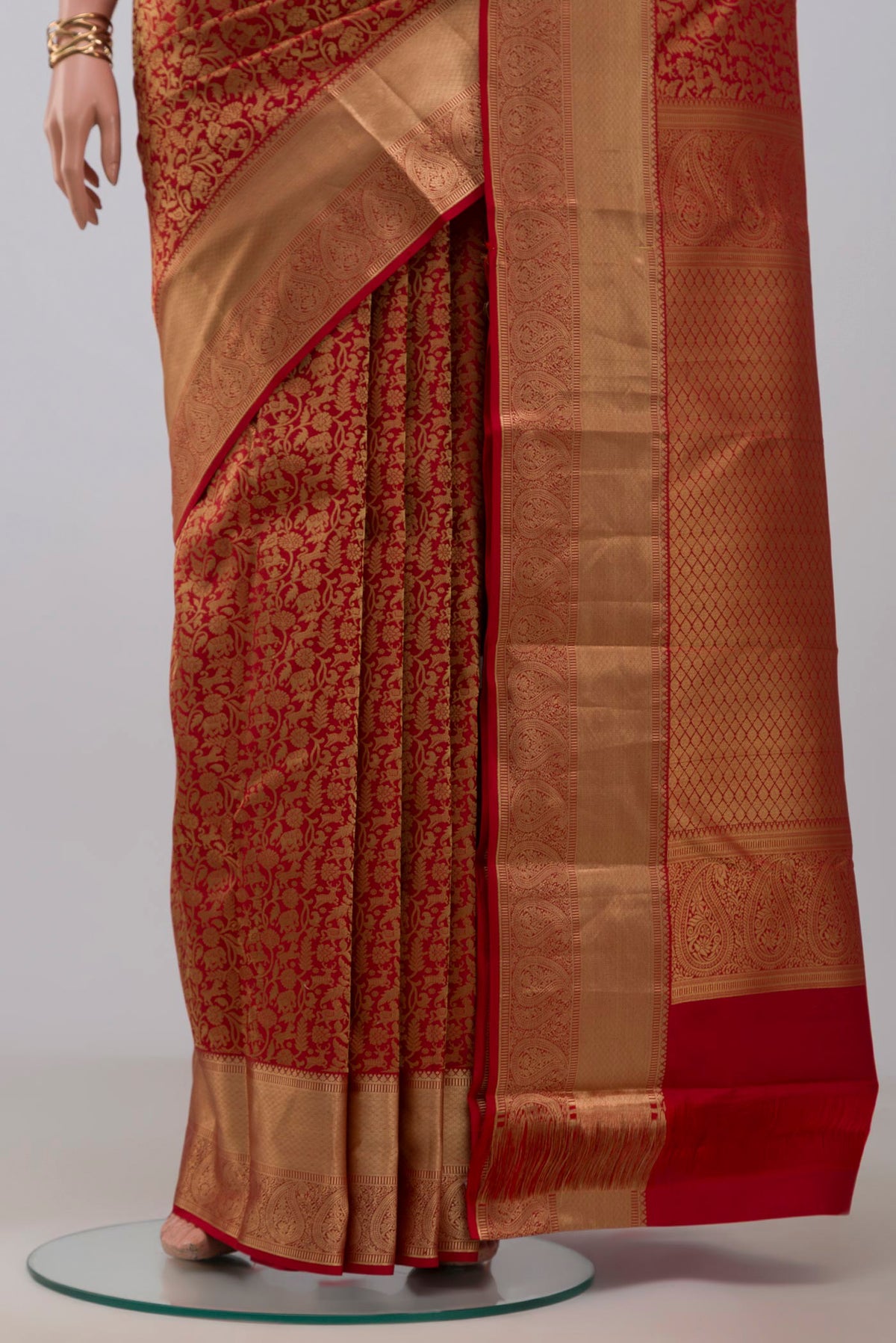 Pleats and pallu of Red Kanjivaram Silk Saree with Zari Brocade on the body and Zari Border. 