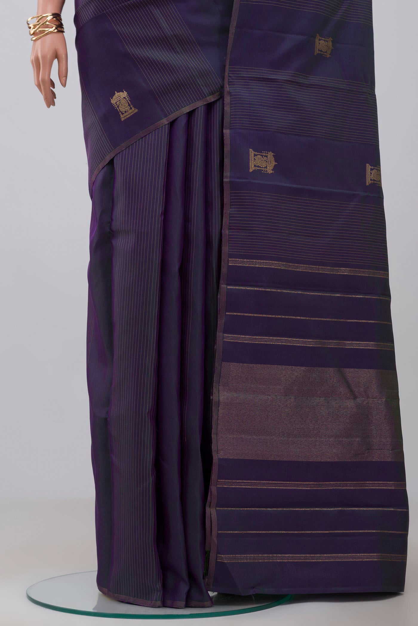 Pleats and pallu of Pure Silk Pure Zari Purple Kanjivaram Saree with Zari Butta on the body and Thin Zari Line. 