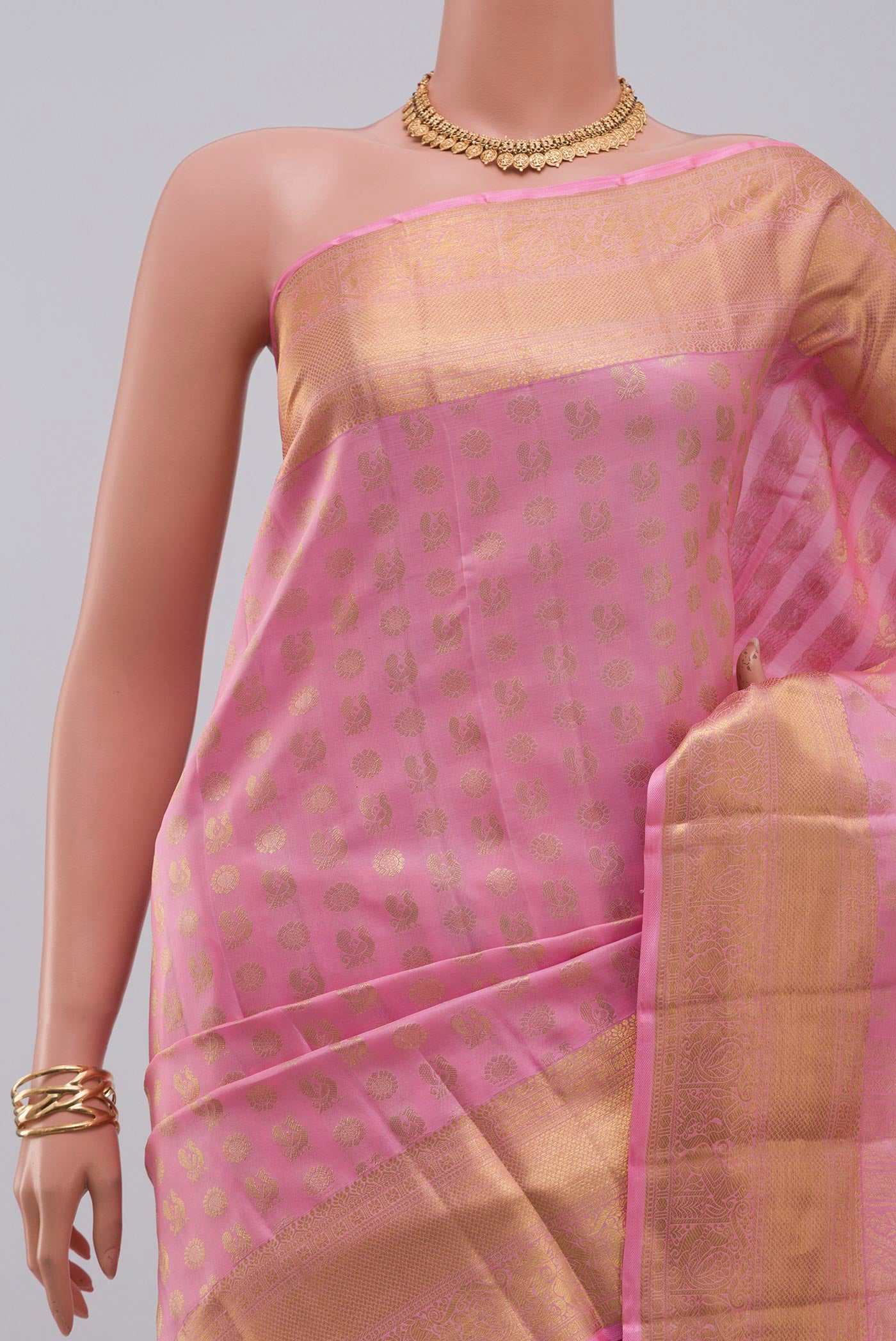 Border image of Pink Kanchipuram Silk Saree with Zari Butta on the body and Zari Border. 