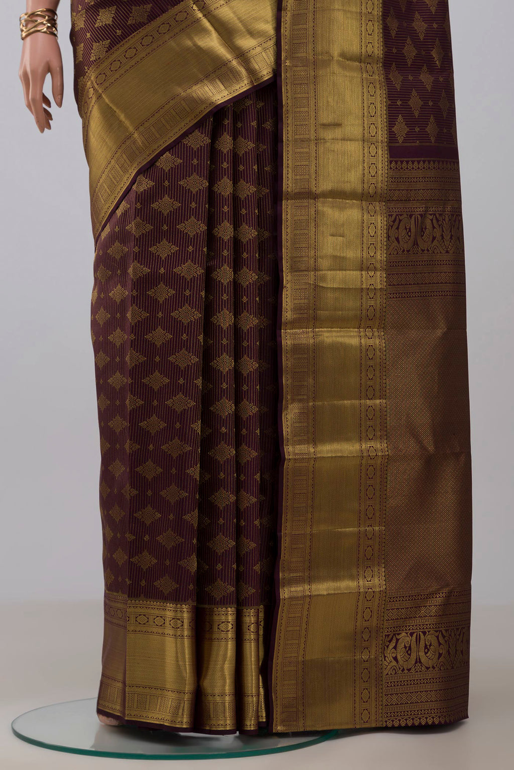 Pleats and pallu of Purple Kanchipuram Silk Saree with Zari Brocade on the body and Zari Border. 