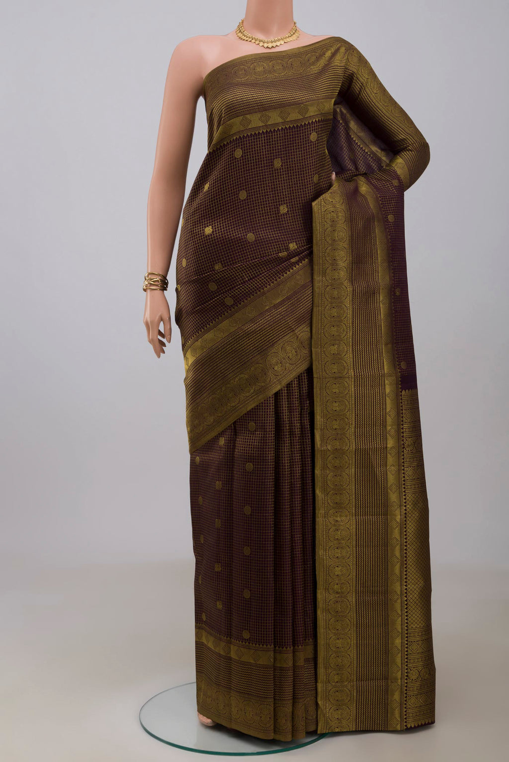 Purple Kanchipuram Silk Saree with Checked design on the body and Fancy Border.  displayed on a mannequin