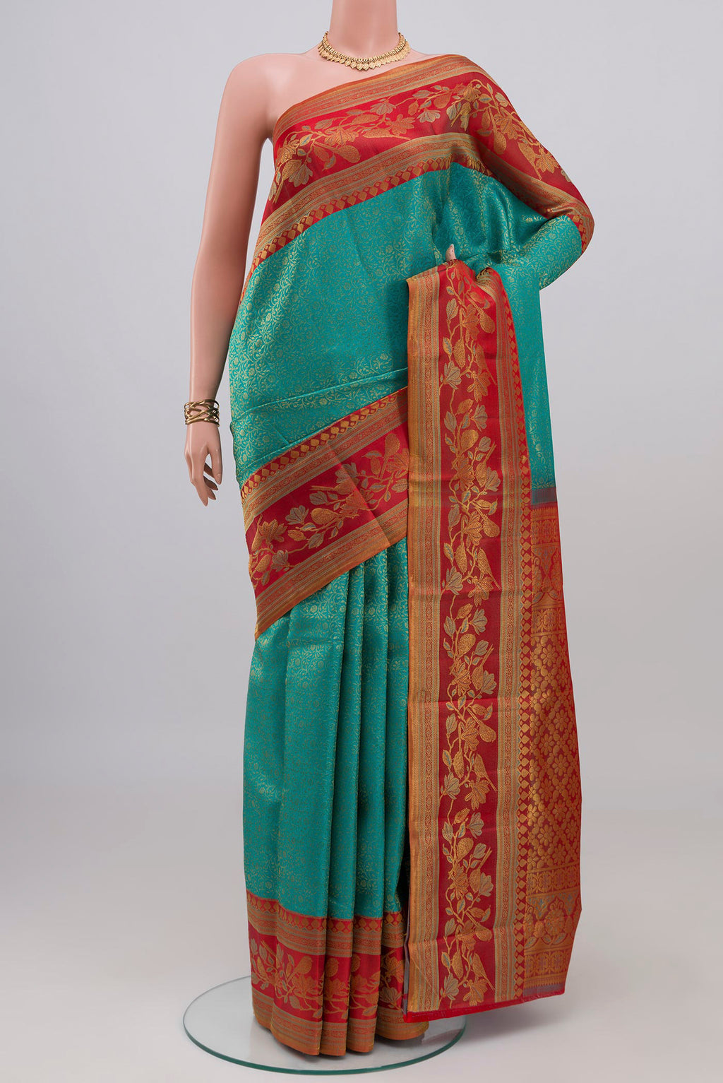 Blue Kanchipuram Silk Saree with Zari Brocade on the body and Zari Border.  displayed on a mannequin