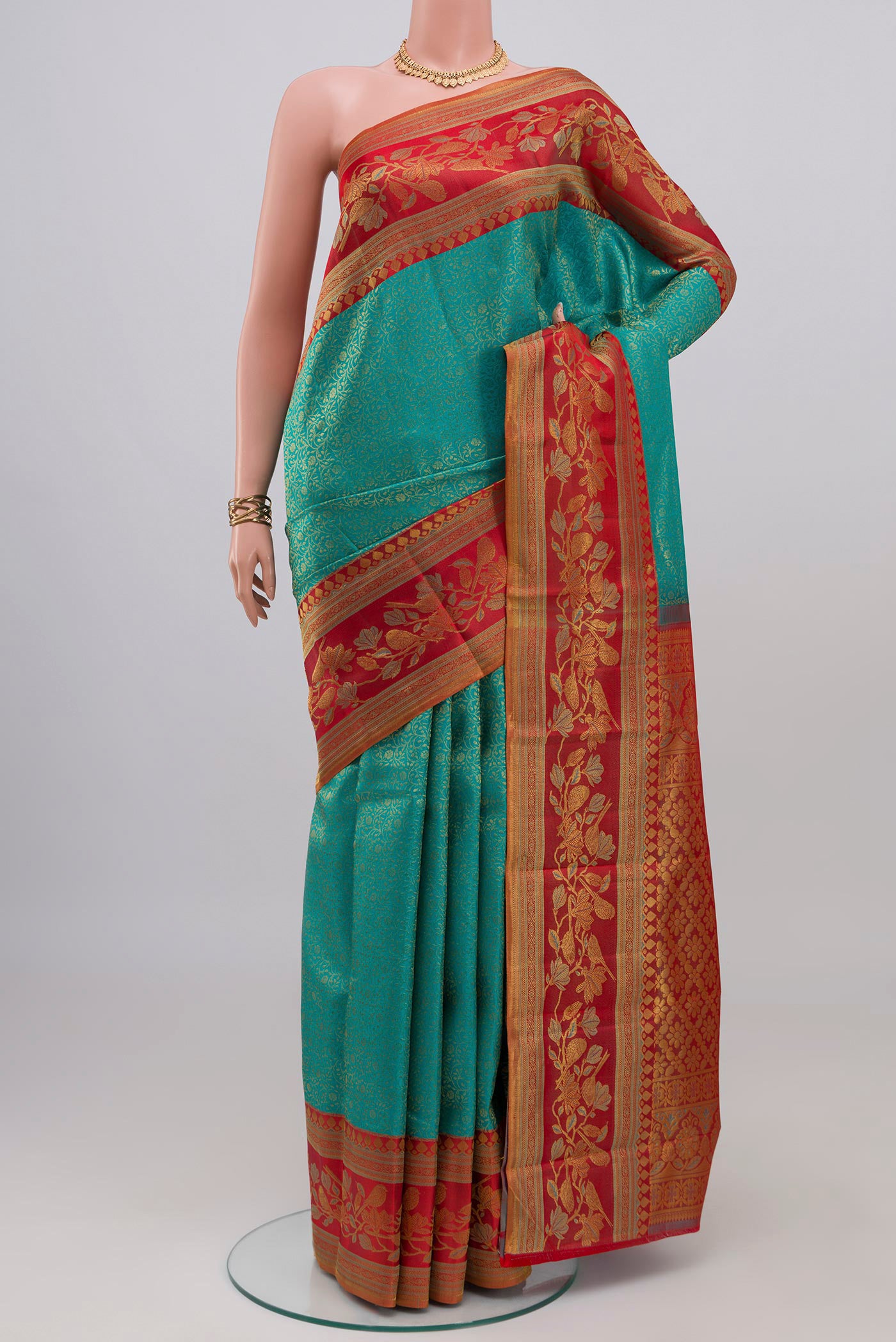 Blue Kanchipuram Silk Saree with Zari Brocade on the body and Zari Border.  displayed on a mannequin