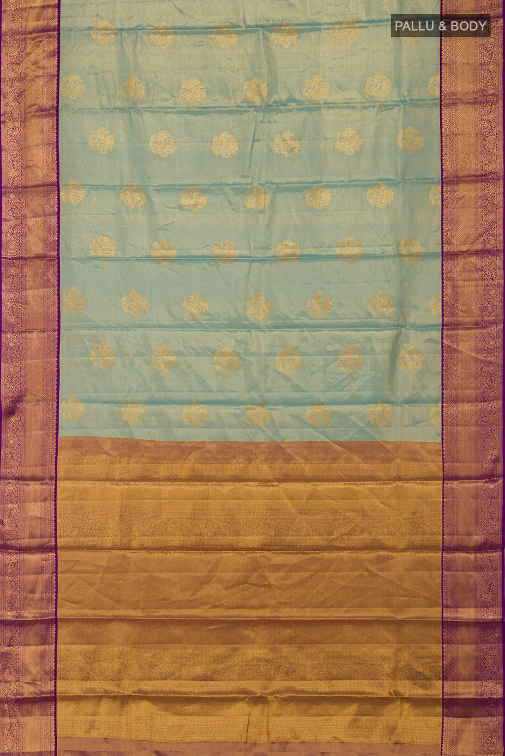 Flat view of Sky Blue Kanchipuram Silk Saree with Zari Butta on the body and Zari Border. 