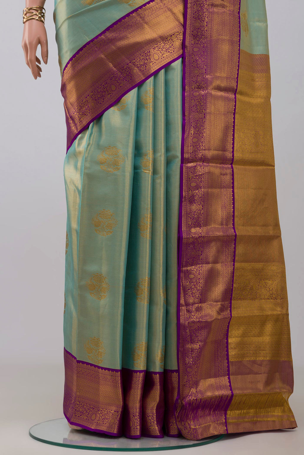 Pleats and pallu of Sky Blue Kanchipuram Silk Saree with Zari Butta on the body and Zari Border. 