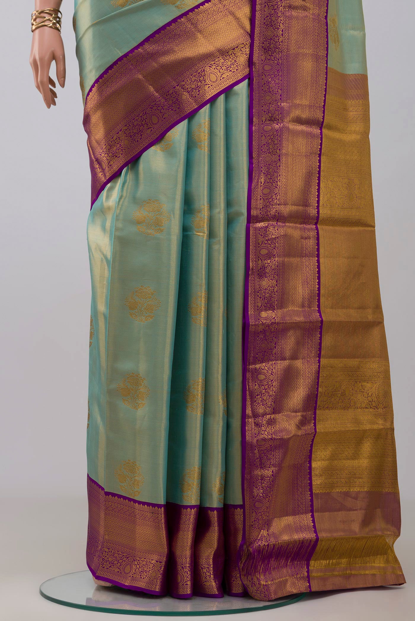 Pleats and pallu of Sky Blue Kanchipuram Silk Saree with Zari Butta on the body and Zari Border. 