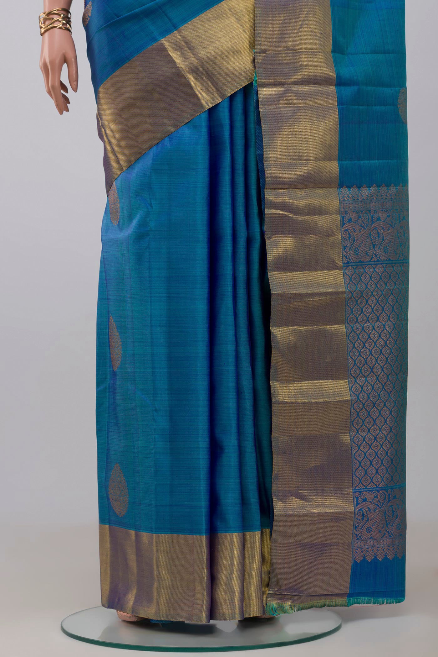 Pleats and pallu of Blue Kanchipuram Silk Saree with Zari Butta on the body and Zari Border. 