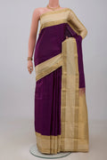 Purple Kanchipuram Silk Saree with Plain Body and Zari Border.  displayed on a mannequin